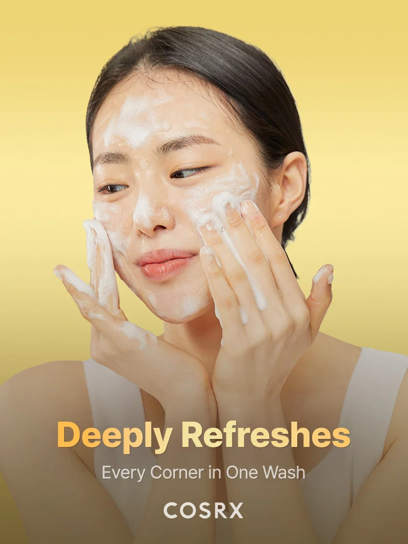 Woman washing face with COSRX Advanced Snail Mucin Gel Cleanser foam