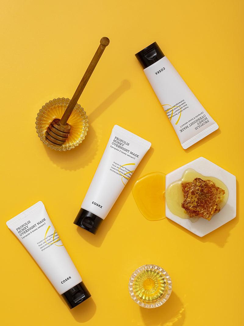 COSRX Propolis Honey Overnight Mask tubes with honey and honeycomb