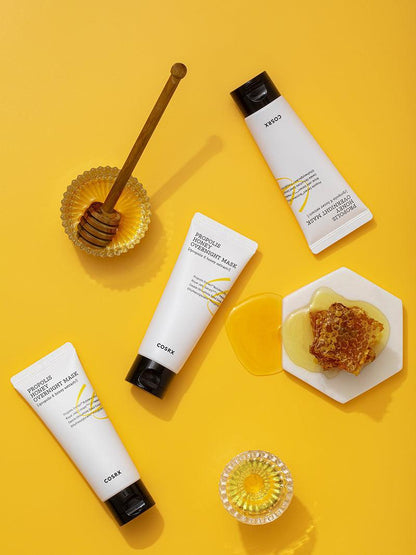 COSRX Propolis Honey Overnight Mask tubes with honey and honeycomb