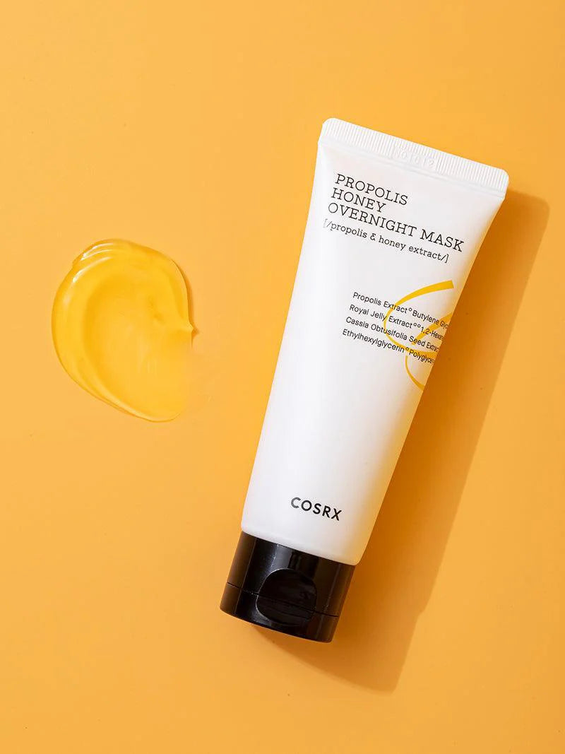 COSRX Full Fit Propolis Honey Overnight Mask tube and texture on orange background